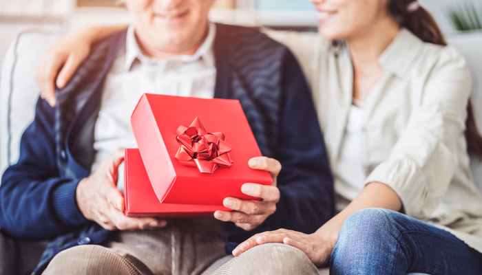 Daughter gives her car enthusiast father a present for christmas